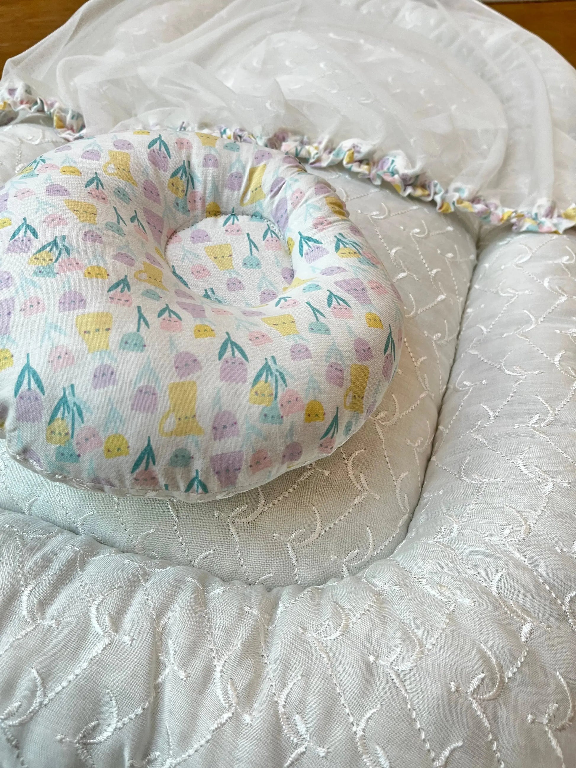 Soft baby pillow and white embroidered bedding with pastel floral pattern, Little Flower